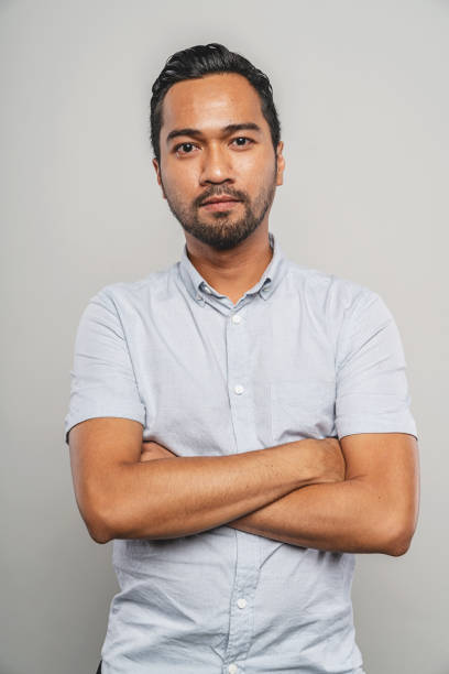 arms crossed malaysian man. portrait. studio shot. kuala lumpur, malaysia.